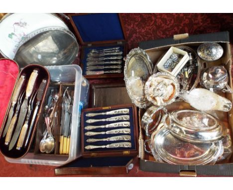 A collection of silver plated wares including a gallery tray, entree dish and cover, further serving dishes, a pair of wine c