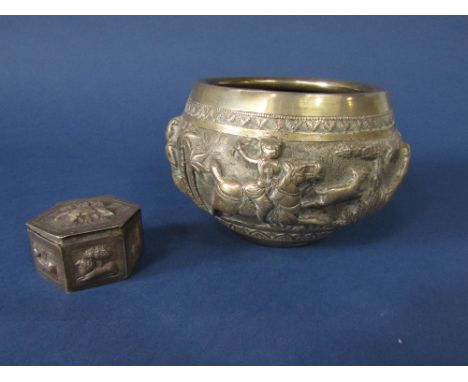 Eastern, probably Indian, white metal bowl, heavily embossed with a hunting scene with men attacking a lion and lioness, engr