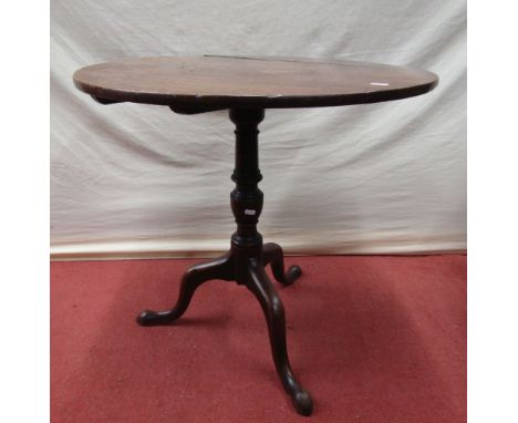 A Georgian mahogany snap top table, the circular top raised on a vase shaped pillar and tripod base, 70cm diameter