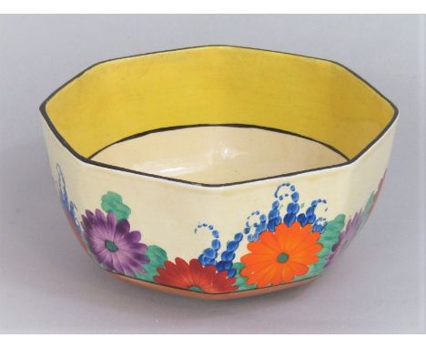 A Clarice Cliff Bizarre Gayday bowl of octagonal form with purple, blue, orange and green floral border decoration and printe