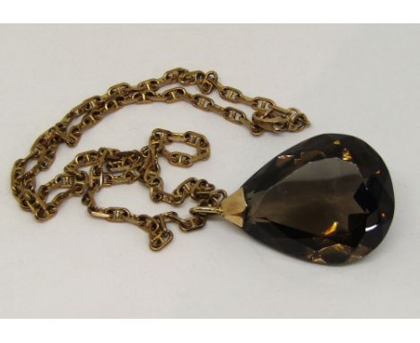 9ct fancy chain link necklace hung with a large faceted smoky quartz pendant with yellow metal loop, chain 13g