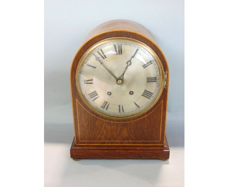 Oak cased dome top two train mantel clock, silvered dial engraved with Roman numerals, striking on a gong, pendulum