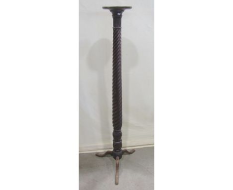A mahogany torchere with rope twist column and shaped tripod supports (fashioned from a 19th century bedpost)