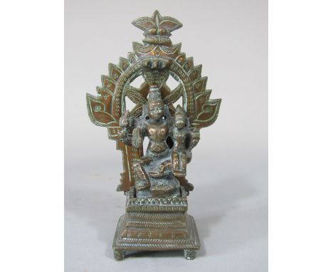 Small Asian 19th century bronze character group of a deity, made up of interlocking pieces, with islamic throne