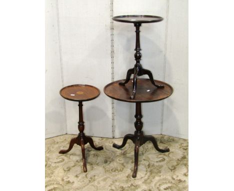 A small 19th century mahogany tripod table with circular dish top, together with two later reproduction examples (3)