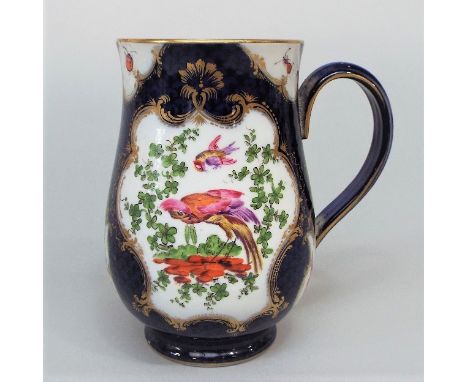 A mid 18th century tankard, probably Worcester, with reserved gilded panels incorporating exotic birds, insects, flowers, etc