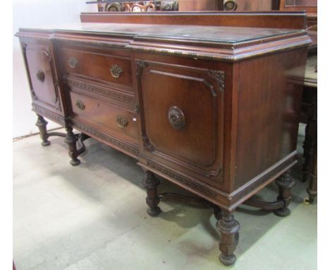 A late Victorian walnut mirrored back side cabinet of narrow proportions, the lower section partially enclosed by a pair of c