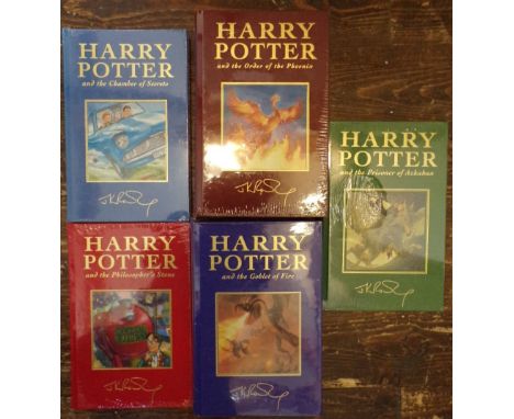 A collection of the first five Harry Potter titles, all deluxe editions with intact original plastic wrapping (5)