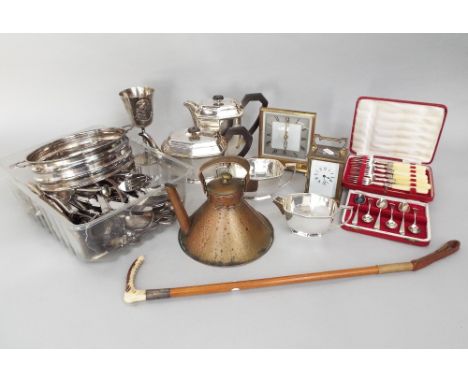 A four piece silver plated tea set by Ibberson together with a silver plated goblet with relief decoration of a golfer - The 