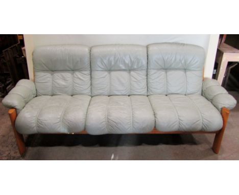 An Ekornes Stressless three seat sofa, with soft mint green stitched leather loose cushions, within a teak wood frame