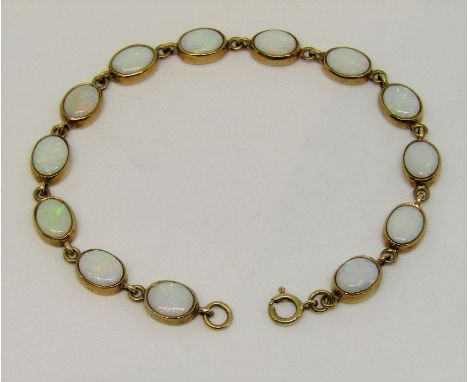 9ct opal bracelet set with thirteen oval opals, 19cm long approx, 8.2g