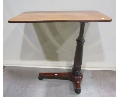 A Victorian mahogany cantilever bed or invalid table with adjustable mechanism, raised on a tripod base with fluted supports