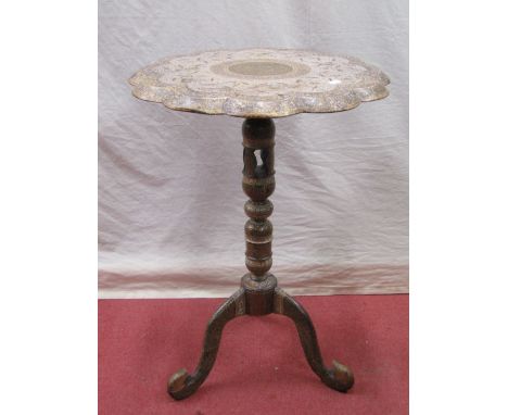 A papier mache Kashmir occasional table, the circular top with fluted borders, raised on a turned and pierced column and trip