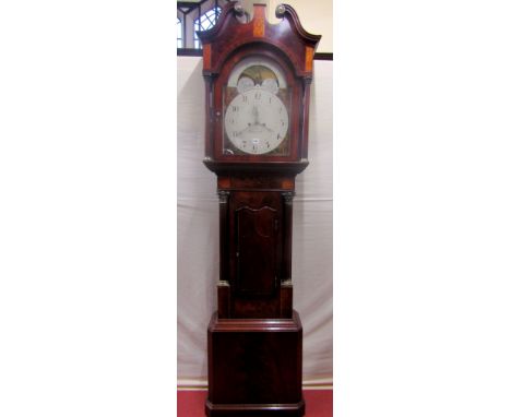 A Regency mahogany longcase clock with well figured flame veneers, the trunk with corinthian column supports, the arched hood