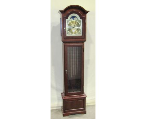 A contemporary reproduction small longcase or grandmother clock with arched hood and dial with moon phase and glazed doors wi