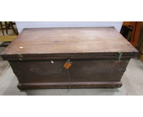 A 19th century travelling trunk with steel banded corners, carrying handles, etc 