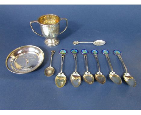 A mixed silver golfing lot to include a collection of enamel crested spoons, Daily Telegraph Tournament lady golfers pin tray