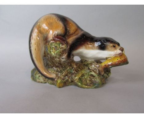 A Sylvac model of an otter with fish, impressed marks to base 3459, measures 17 cm tall approx