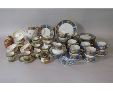 A collection of Japanese eggshell porcelain peacock Chinaware teawares with painted landscape and decoration on a turquoise a