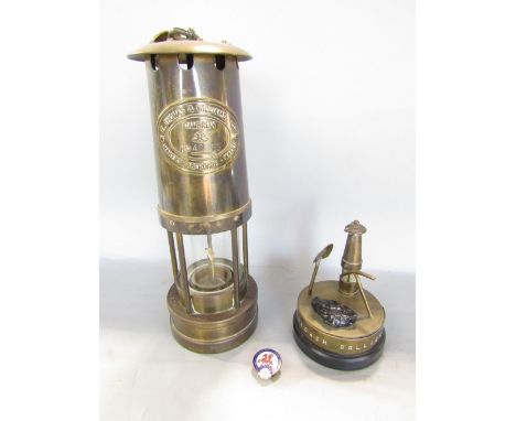 A miners lamp by E Thomas &amp; Williams, Cambrian number 40353, together with a small commemorative group commemorating the 