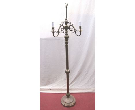 A brass floorstanding three branch lamp standard, raised on a turned column and disk base 