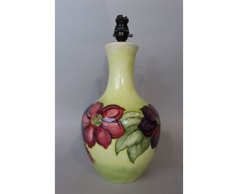 A substantial Moorcroft yellow ground table lamp base with purple and pink floral garland decoration and with painted signatu