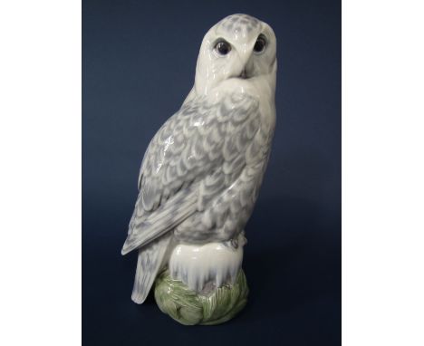 A large Royal Copenhagen model of a snowy owl with printed and painted mark to base no 1829, 39.5cm tall approx
