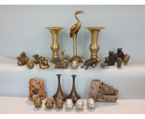 A collection of eastern wares including two bronzed figures of a pig and a rat, both with baskets, pair of trumpet shaped vas