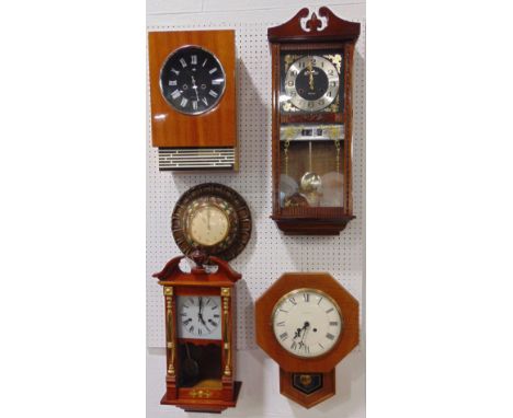 A collection of five various vintage wall clocks to include a 31 day clock with day/date aperture, a USSR retro wall clock an