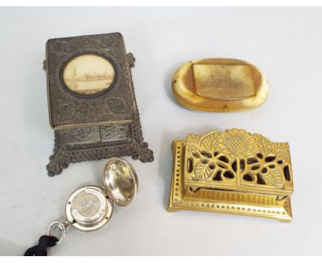 Cast brass stamp box, silver plated sovereign case, horn snuff box, further vesta box showing the Houses of Parliament