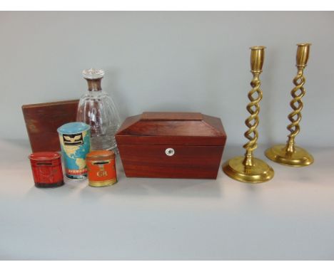 A 19th century sarcophagus shaped tea caddy, cut glass decanter with silver collar, pair of open spiral twist brass candlesti