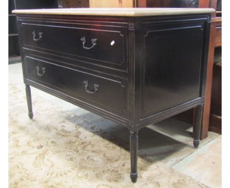 An oak commode of two long drawers, raised on turned and fluted supports, with painted finish beneath a striped top, 120cm wi