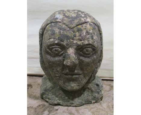 Antique stone corbel in the form of a face, 23cm high