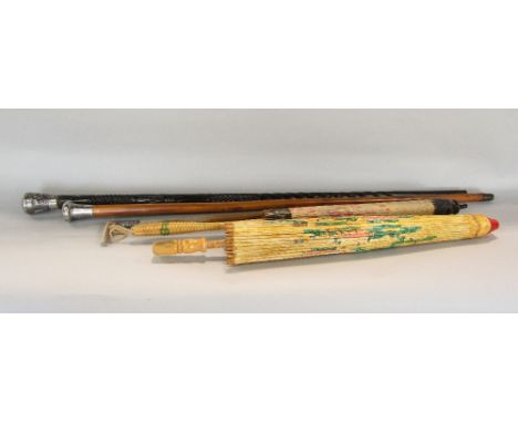 A Malacca cane with engraved silver mount, a further ebony walking stick with embossed Indian silver mount, two Japanese para