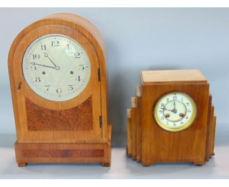 Art Deco walnut cased twin train mantels clock, with enamel chapter ring, arabic numerals, striking on a gong, within a stepp