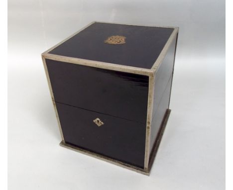 Ebonised wooden decanter box with plated mount and monogrammed detail with detail to the rising lid and with four sectional i