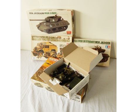 A Tamiy model kit of a British 25PDR field gun and quad gun tractor, another of a tank, two further tank model kits and some 