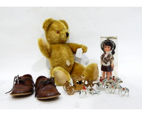 A vintage plush teddy bear with glass eyes, a Crescent Toys diecast model of the Coronation Royal Coach, a pair of child's sh