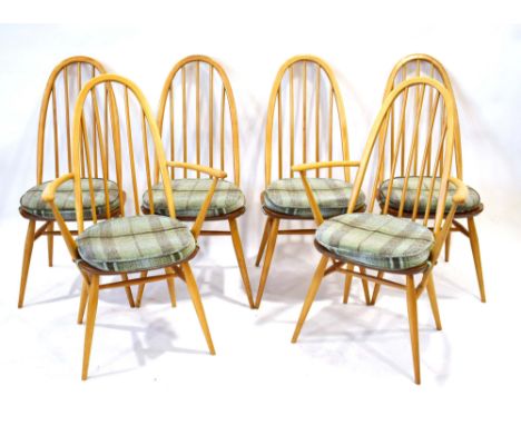 A set of six Ercol elm and beech Windsor chairs including two carvers, each with a padded loose seat cushion*Sold subject to 