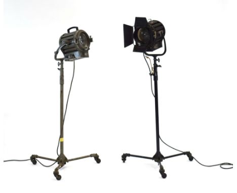 A pair of Mole-Richardson Ltd. Type 406 'Solar Spot' stage spotlights, one in grey and one in black, each on a stand and trip