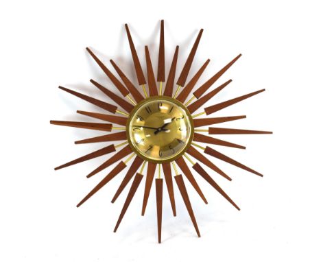 An Anstey &amp; Wilson teak 'sunburst' or 'starburst' wall clock with a brass finished dial and teak rays