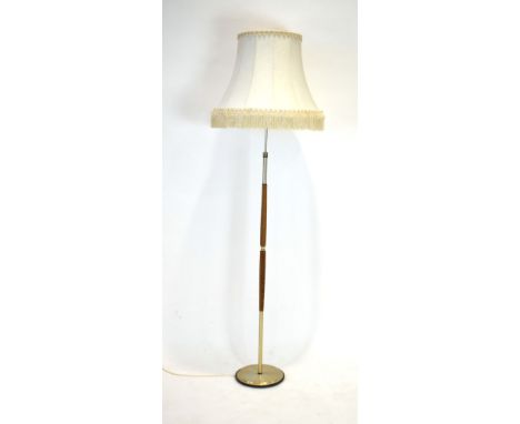 A Vitrika 1970's brass coloured and teak segmented floor lamp with shade CONDITION REPORT: Lead cut, wear.