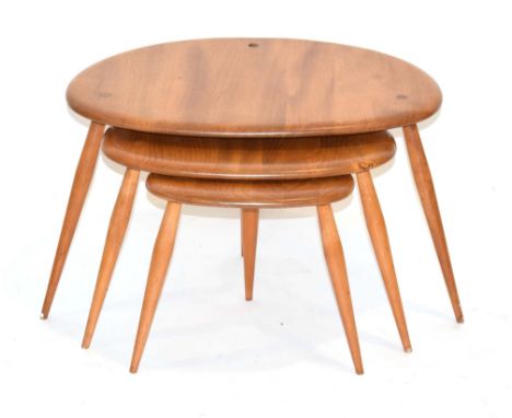 A nest of three Ercol 'Pebble' nesting tables in elm and beech, max. w. 64 cm