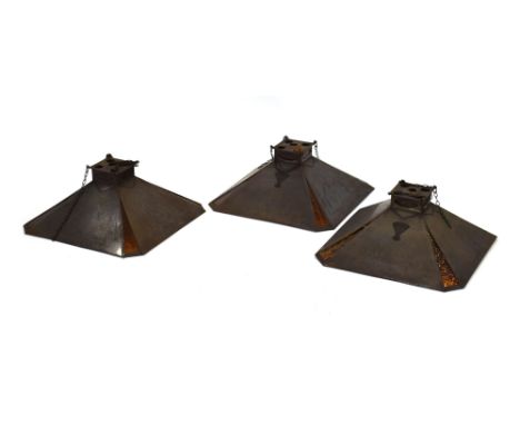 A set of three 'Light Efficiency' ceiling lights by The Amplifier Illumination Company with mirrored interiors and orange gla