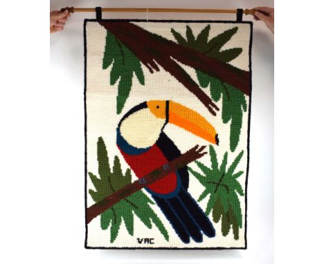 Valdivino Alves de Conceicao, a 1987 Brazilian woven tapestry depicting a toucan, signed VAC, 98 x 70 cm, hanging from a beec