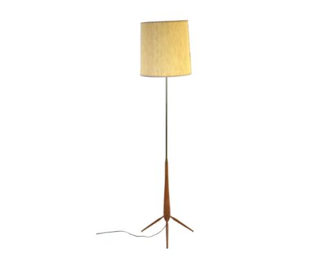 A 1960's turned teak and brass standard lamp with a tripod base CONDITION REPORT: Currently working. The shade is fairly good