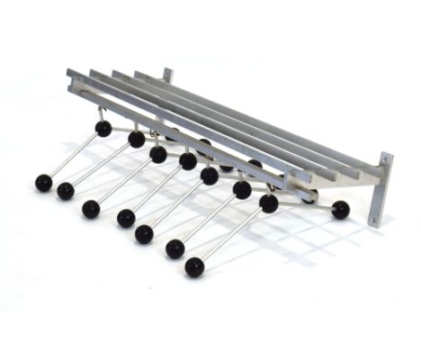 A 1970/80's aluminium hall shelf, the rails suspending seven hangers each with a black spherical end