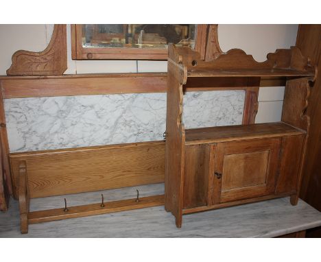 A small pine wall unit of two shelves over a single panel door cupboard, 44.5cm wide, together with a pine shelf with hooks b