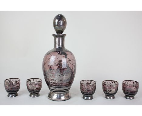 A Venetian amethyst glass decanter with five matching glasses, with overlaid silver design depicting lovers, gondolas and bui