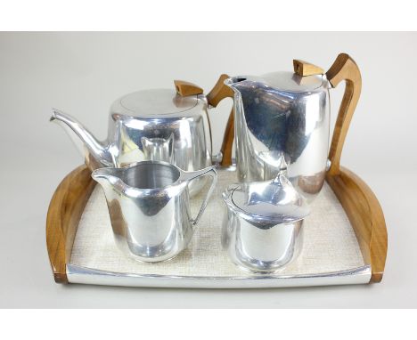 A Picquot Ware tea set comprising teapot, hot water jug, milk jug, sugar pot and tray